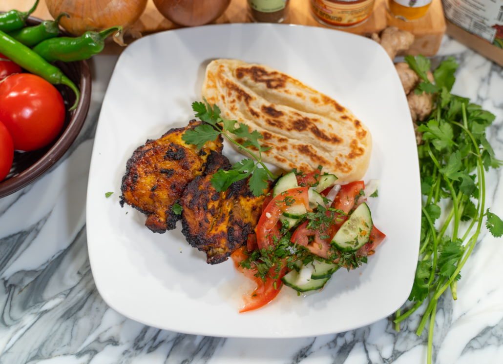 tandoori chicken cucumber salad and naan