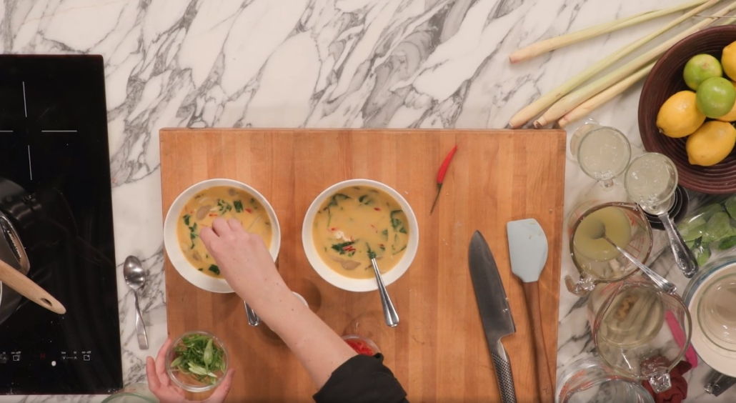 lemongrass soups being garnished